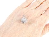 an image of a woman ' s hand with a diamond ring on it