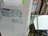 a refrigerator that has a sticker on the side of it
