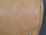 tan ostrich leather handbag with rivets and rivets