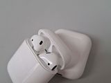 two airpods sitting on top of each other on a table