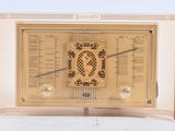 an old fashioned radio that is sitting on a table