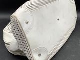 white leather purse with perforsants on the inside of it