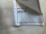 a close up of a piece of fabric with a label on it