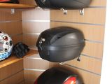 many helmets on the shelves in the room