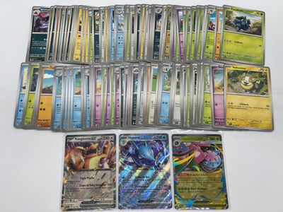 a lot of different pokemon cards on the table