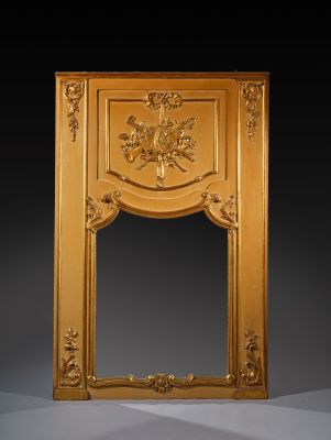 an ornately carved fireplace surround with flowers and leaves