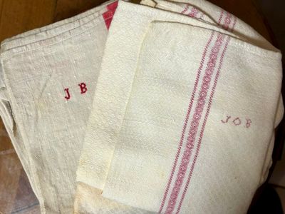 a stack of towels sitting on top of a wooden table