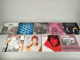 the doors albums are lined up on a white table