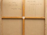an old picture of a piece of cardboard with writing on it