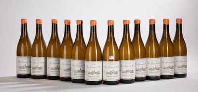 six bottles of wine lined up in a row on a table