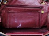 a red purse that is sitting on a table