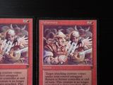 two cards that are sitting on a table