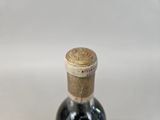 a bottle of wine that is sitting on a table