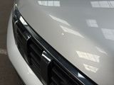 a close up of a car ' s front grill and grille