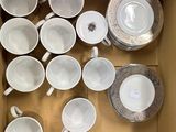 a lot of cups and saucers in a box