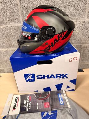 a helmet on top of a box on a table