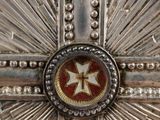 cross of the order of the knights of france with a red and gold decoration