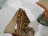 a figurine of a sailboat on a table
