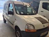 a white van parked in a garage next to a white van