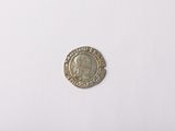 an image of a silver coin on a white surface