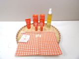 bottles of sunscreen and lotion sitting on a basket on a table