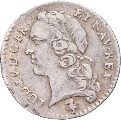 gros plan d'une pièce de monnaie sur laquelle figure une tête de femme