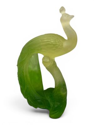 an image of a green sculpture of a bird on top of a leaf