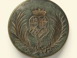 an image of a metal button with a crown on it