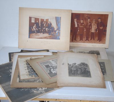 several old photographs of men and women are sitting on a table