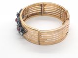 an image of a close up of a bracelet on a white surface
