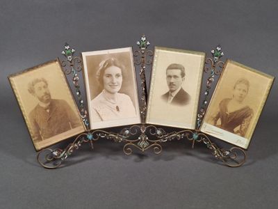 four antique photo frames of a man, woman, and child