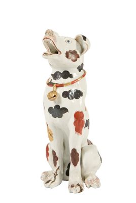 figurine de chien dalmatien avec des taches rouges, noires et blanches