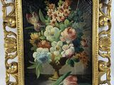 painting of a vase of flowers in a gold frame on a white background