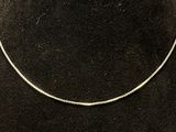 sterling silver snake chain necklace on a black velvet necklace stand