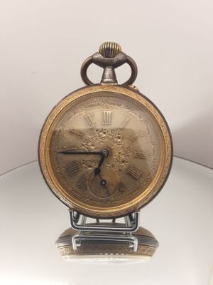 a clock that is sitting on top of a glass table
