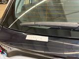 a car that has a sticker on the back window of it