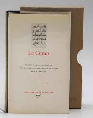 french book le coran, with arabic writing, on a white background