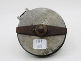 a close up of a metal object with a tag on it