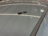 a remote control on the windshield of a car
