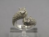 an image of a diamond snake ring on a clear surface