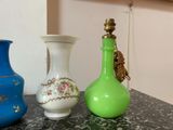 three vases sitting on a table next to each other