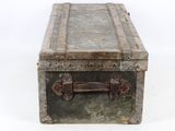 an old suitcase with a metal handle on a white surface