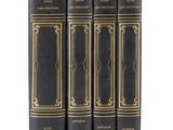 un lot de quatre livres noirs aux bordures dorées