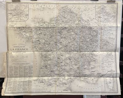 an old map of france on display in a glass case
