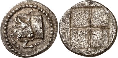 a silver coin with an image of a lion on it