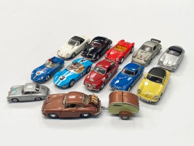 a lot of toy cars that are on the table