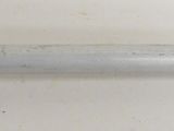 a close up of a metal pipe on a white surface