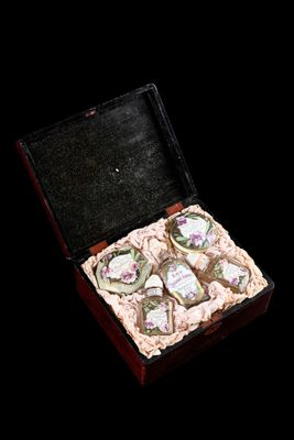 a small box with a bunch of small pieces of food inside of it