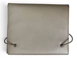 a gray leather wallet with a knot on the front