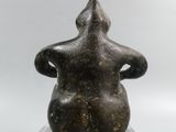 an image of a statue of a woman sitting on top of a clear base